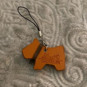 Lindt chocolate dog, leather bag, charm